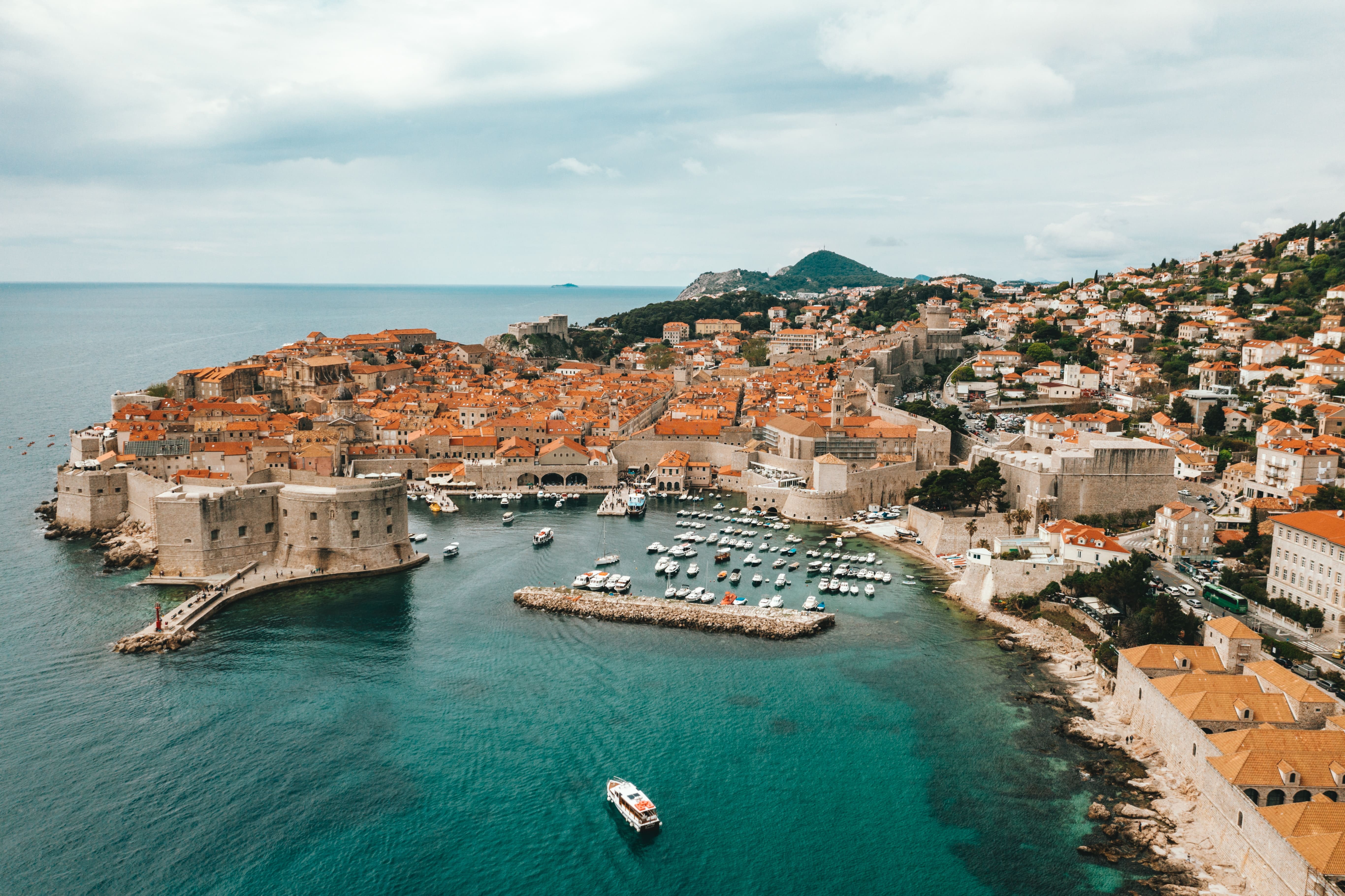 Aerial view of old city of Dubrovnik with old port in front, PEO Croatia 