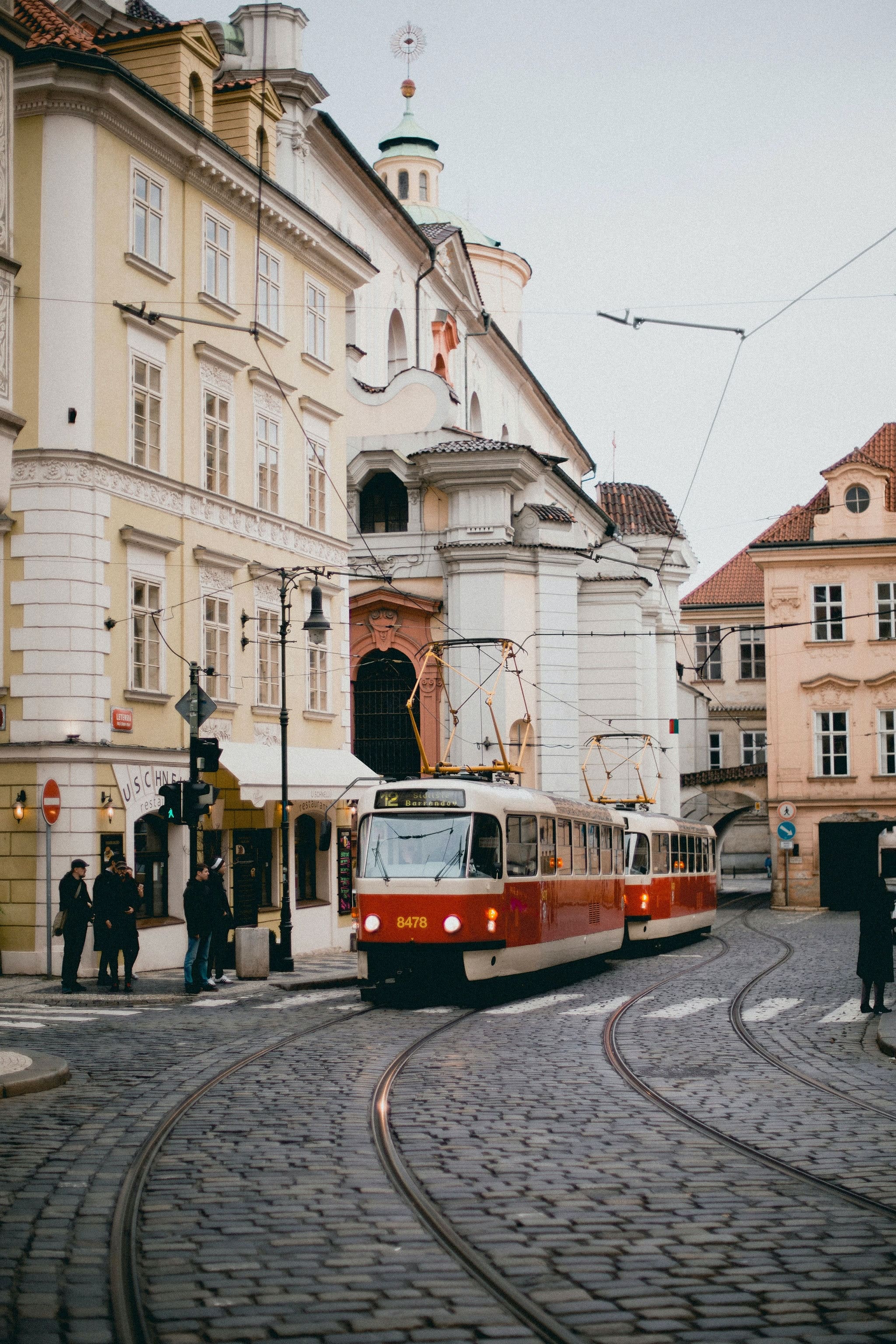 Charming Prague tram crossing the street, Czech Republic PEO services