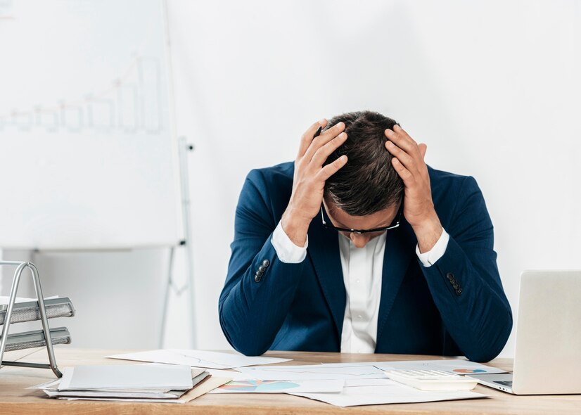 medium-shot-stressed-man-looking-papers_23-2148773978