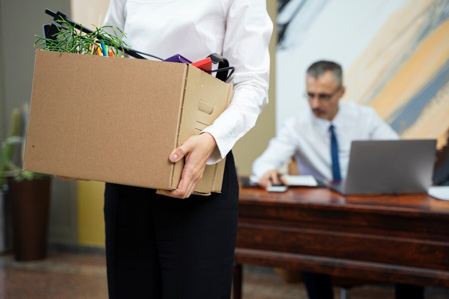 woman-carrying-cardboard-box-side-view_23-2149445765